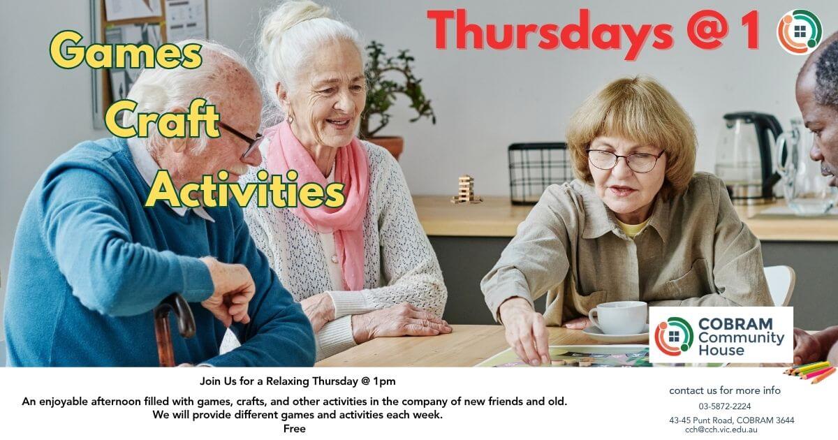 Three people sitting around a table socialising
