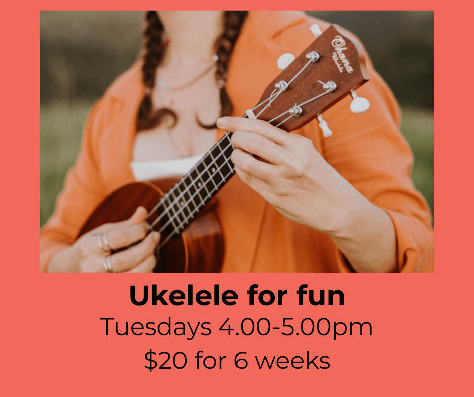 An image of a female playing a ukelele